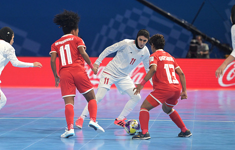 Seyedehnastaran Moghimidarzi (C) of Islamic Republic of Iran Women Futsal team, Erika Janeth Hernandez Diaz (L) and Libeth Adonay Vasquez Herrera (R) of Panama Women Futsal team seen in action during the Group C First Stage match between Iran and Panama at the FIFA Futsal Women's World Cup 2025 held at PhilSports Arena. Final score Islamic Republic of Iran 6 : 2 Panama