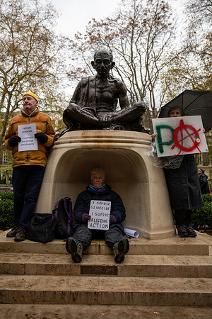 Palestine Action supporters hold placards whilst surrounding the Gandhi statue in Tavistock Square before a demonstration. Activist group 'Defend Our Juries' held a demonstration supporting the de-prescription of 'Palestine Action' as a terrorist organisation. People gathered in Tavistock Square, London holding handwritten signs saying, “I support Palestine Action.” Being a member of or showing support for a prescribed organisation can lead to prosecution under the 2000 terrorist act.