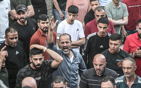 Palestinian relatives and friends of Hikmat Abdul Nabi, 34, mourn during his funeral in the village of Askar al-Balad, east of Nablus, in the West Bank. Hikmat was killed during an Israeli military operation in the Masaken al-Shaabiya neighborhood near Nablus, in the West Bank, after an Israeli Air Force drone fired a missile at him.