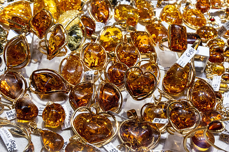 Jewelry mainly pendants with amber stone seen at Sukiennice market space in the Main Market Square. Amber is considered a traditional wealth of all Baltic countries.