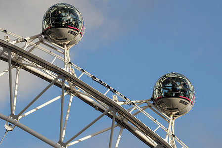 Tourists seen inside the capsules of the London Eye.