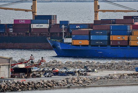 Two container ships intersect at the entrance of French Mediterranean port of Marseille.