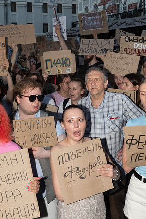 Protesters seen holding cardboard signs demanding the return of Fedorov while voicing opposition to the recent dismissal of the Defence Minister during a public demonstration. Protests against the dismissal of Minister of Defense Mykhailo Fedorov are continuing for the second day in several major Ukrainian cities. Participants in the actions including veterans of the Armed Forces of Ukraine demanded the politician's reinstatement expressing their protest with slogans such as "Fedorov is Minister of Defense!", "Bring Fedorov back," and "Fedorov = Victory," while also criticizing government personnel decisions with signs like "Deputies, get to work!", "Office of stupid decisions," and calling for the resignation of the Commander-in-Chief of the Armed Forces with chants of "Out with Syrskyi!!!." President Volodymyr Zelenskyy explained the resignation by citing a lack of mutual understanding between the minister and the military leadership as well as unresolved problems regarding mobilization and equipment after which the Verkhovna Rada officially approved Fedorov's dismissal as part of a government rotation.