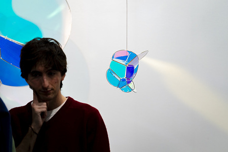 Visitors observe artworks on display during the 45th edition of ARCO (Spain's International Contemporary Art Fair) at the IFEMA exhibition center in Madrid. ARCO is one of Europe's leading contemporary art events, bringing together galleries, artists and collectors from around the world to present and discover new artistic practices and market trends.