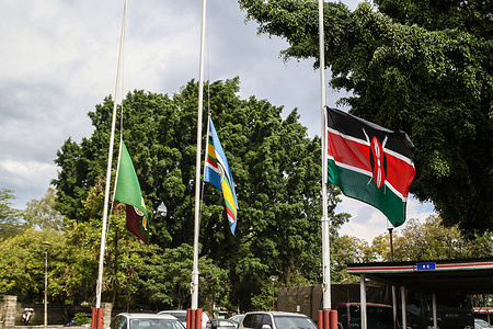 The flag of Kenya (R), East African Community flag (C) and that of the Kenya Administration Police fly half-mast at The Office of The President, Rift Valley Regional Headquarters in Nakuru as Kenya Mourns Her Majesty, Queen Elizabeth II. The outgoing Kenyan president, Uhuru Kenyatta, on September 9, 2022, ordered flags at half-mast in honor of the life of the Late Queen. The flags will remain half-mast until sunset Monday, September 12, 2022.