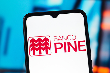 In this photo illustration, the Banco Pine logo is seen displayed on a smartphone screen.