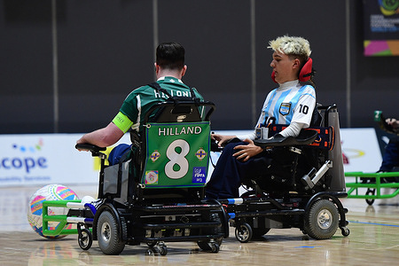 Valentino Zegarelli (R) of the Argentina powerchair football team and Scott Hilland (L) of the Northern Ireland powerchair football team seen in action during the FIPFA Powerchair Football World Cup 2023 match between Argentina and Northern Ireland at Quaycentre. Final score; Argentina 1:1 Northern Ireland.