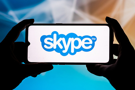 In this photo illustration a Skype logo seen displayed on a smartphone.
