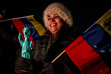 A Venezuelan national celebrates the capture of the Venezuelan dictator Nicolas Maduro during a rally. Millions of Venezuelans worldwide gather to celebrate after a successful mission by U.S. forces, with limited internal military cooperation, resulted in the capture of Nicolás Maduro. Now in U.S. custody, the former leader faces federal charges in New York.