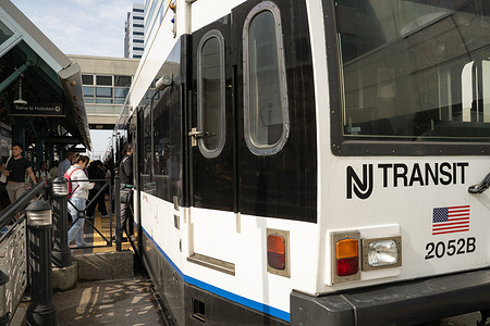 People board a southern-bound Light Rail train as the NJ Transit Rail Strike begins in New Jersey, US, on Friday, May 16, 2025. New Jersey locomotive engineers began a rail strike early Friday, triggering a shutdown of NJ Transit rail services which resulted in travel disruptions for thousands of commuters.