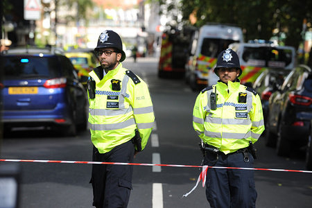 Policemen stands around the Parsons Green Underground Station.
Several injured at Parsons Green as passengers report seeing device on District Line tube train during morning rush-hour.
A large police deployment is guarding the access to the station. The nearest houses to the station have been evacuated until the zone is safe. The police warms more explosives.