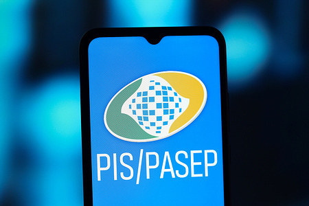 In this photo illustration, the PIS - PASEP logo is seen displayed on a smartphone screen.