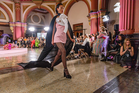 A model wearing an outfit by designer Mariam Seddiq walks the runway during the closing night runway of Melbourne Fashion Week. Sunday saw the closing night runway of Melbourne Fashion Week with a glamorous setting under the impressive, grand dome at 333 Collins, the granite columns, decorative arches and elaborate wrought iron features were the backdrop for a showcase of high-end Australian fashion, Melbourne Australia.