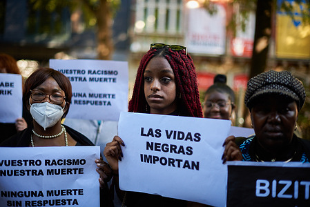 A protester holds a placard that says "Black Lives Matter" during a demonstration in Pamplona. Almost a thousand people demonstrated today in Pamplona with the slogan, "Black lives matter" with the hashtag #MasacreMelilla, to condemn the Morrocan police for killing 35 people when they tried to jump the fence that separates Africa from Spain on June 25, 2022.