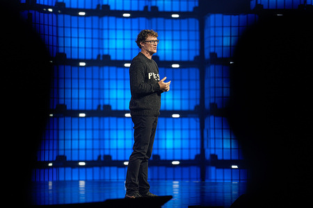 Paddy Cosgrave, CEO & Founder at Web Summit, addresses the audience during the opening night of the Web Summit 2025 in Lisbon. The Web Summit 2025 commenced in Lisbon on November 10th, drawing over 70,000 attendees to focus overwhelmingly on the future and transformative impact of Artificial Intelligence. The Opening Night ceremony at the Altice Arena featured high-profile speakers, including the Mayor of Lisbon and Maria Sharapova, setting the stage for the four-day technology conference. A key announcement was the launch of the Sports Tech Startup Challenge by IBM and Web Summit, aimed at identifying startups leveraging AI in sports and entertainment.