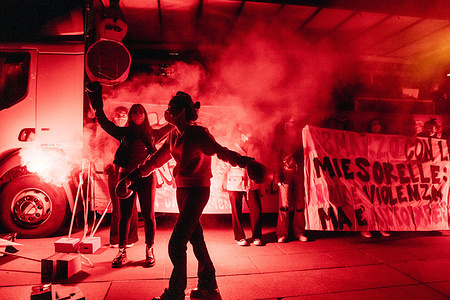 A protester seen performing a boxing performance illuminated by a burning flare during the demonstration.
The International Women Day was celebrated in Duomo Square, in Milan, where the feminist movement Not One Less presented several guests, local associations, and speakers reporting about different kind of violence and consequence. The organization of the celebration had been effected by recent restrictions anti-Covid19, avoiding the traditional walk.