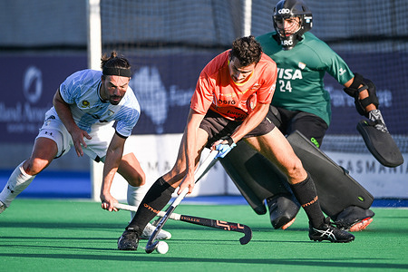 Federico Monja (L) of Argentina National Men's field hockey team and Nathan Ephraums (C) of Australia National Men's field hockey team in action during the 2022/23 International Hockey Federation (FIH) Men's Pro-League match between Argentina and Australia at Tasmanian Hockey Centre. Final score; Australia 3:0 Argentina.