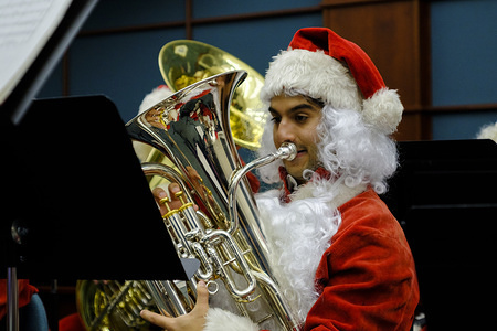 BLOOMINGTON, UNITED STATES, DECEMBER 2, 2019:
Tuba Santas perform during the Holiday Farmers Market in Bloomington.
Harvey Phillips, who died in 2010, held the first Tuba Christmas performance in 1974, and the tradition has continued for 45 years. Phillips was a renowned tuba player.