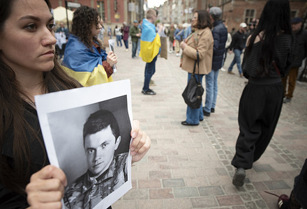 A protester holds a photo of a Ukrainian soldier during a rally in Gdańsk titled “Where are the defenders of Mariupol?”. A rally organized by the Ukrainian community was held in Gdańsk to honor the defenders of Mariupol and the soldiers who were taken prisoner by Russia and remain in captivity. The release of the defenders of Mariupol is taking place gradually as part of successive prisoner-of-war exchanges between Ukraine and Russia. It is estimated that between several hundred and over a thousand soldiers from the Mariupol garrison alone remain imprisoned in Russian camps and detention centers. A dance performance took place during the rally.
