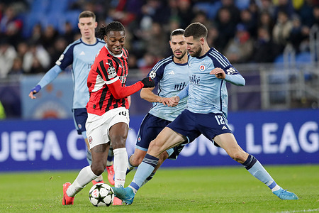 Rafael Leao of AC Milan (L), Kyriakos Savvidis of Slovan Bratislava (C), and Kenan Bajric of Slovan Bratislava (R) seen in action during the UEFA Champions League match between Slovan Bratislava and AC Milan at Tehelne Pole Stadium. Final Score; Slovan Bratislava 2:3 AC Milan.