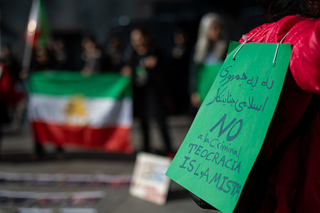 A protester holds a placard during a demonstration. A rally was organized at Callao Square by Iranian residents in Madrid and the association "Women, Life and Freedom" to denounce the intensification of repression by the Islamic State against the Iranian population in recent weeks.