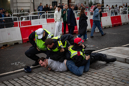 A man is arrested following an altercation during the demonstration. Thousands of demonstrators rallied in central London in opposition of a Unite the Kingdom protest, organized by the former English Defence League leader, Tommy Robinson. Robinson was scheduled to attend the march, but is currently being remanded in custody before a court appearance on Monday.