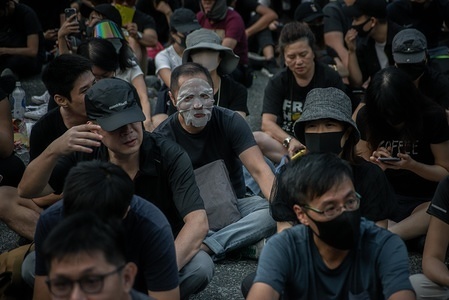 Protesters sit at the Charter Garden as they take part during the demonstration.
Hong Kong protesters demonstrate for 22nd consecutive weekend in Central district of Hong Kong. Protesters continue to call for Hong Kong's Chief Executive Carrie Lam to meet their remaining demands since the controversial extradition bill was withdrawn, which includes an independent inquiry into police brutality, the retraction of the word "riot" to describe the rallies, and genuine universal suffrage.