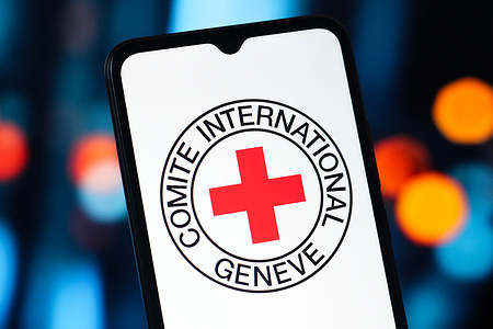 In this photo illustration, the ICRC (International Committee of the Red Cross) logo is seen displayed on a smartphone screen.