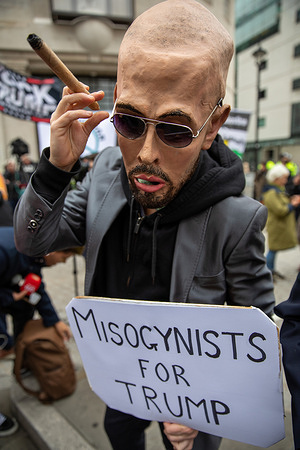 An activist dressed as Andrew Tate holds a placard during a demonstration. Several groups and charities organised a rally in Central London to protest against US President Donald Trump’s second state visit to the UK. The demonstration, coordinated by the ‘Stop Trump Coalition’, aimed to express opposition to the UK Government's invitation and to highlight concerns, the organisers made some policies of the US President, which they described as ‘neo-liberal’ and ‘fascist’.
