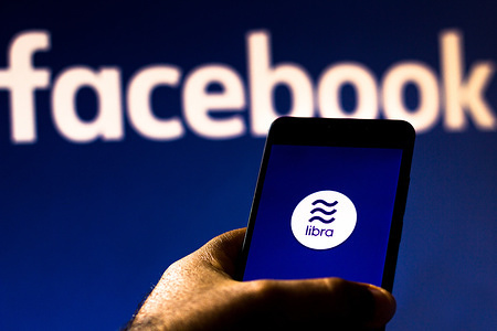 In this photo illustration the Facebook Libra logo is seen displayed on a smartphone.