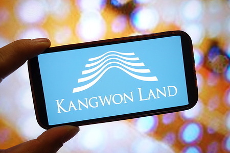 In this photo illustration, a Kangwon Land company logo is seen displayed on a smartphone screen.