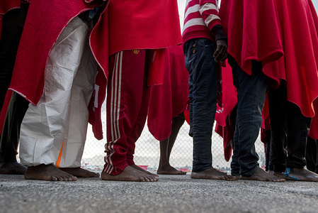 Bare feet of some of the migrants that arrived to Motril port. 37 people were rescued from a rubber boat in Mediterranean Sea and brought at Motril port.