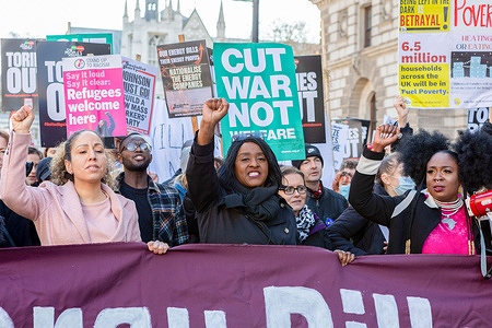 Protestors seen holding a banner with placards expressing their opinion, during the demonstration.The Office of Gas and Electricity Markets (Ofgem) announced that from 1st April 2022 onwards, a 54% hike in energy price cap will come into effect. An estimated 22 million customers will see a £700 jump in their energy bills annually. In conjunction with inflation, the introduction of National Insurance and cuts in Universal Credit, people are facing a rising cost of living that wages cannot keep up with. Organised by Disabled People Against Cuts (DPAC), Revolutionary socialism in the 21st century (rs21), Fuel Poverty Action and United Community, hundreds of protestors rallied at Parliament Square to demand that the government act on the cost of living crisis.