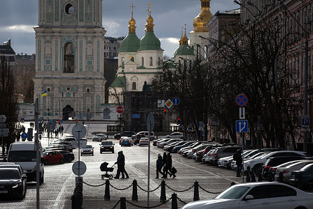 People seen walking in the city. Ukrainian army on the front lines is suffering from a shortage of weapons but the capital is living a relatively calm life.
