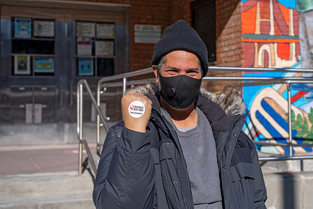 A man displays a sticker on his hand saying I Got vaccinated! after exiting the state run vaccination pop-up site inside the Jacob A. Riis Settlement House at Queensbridge Houses in the borough of Queens in New York City.