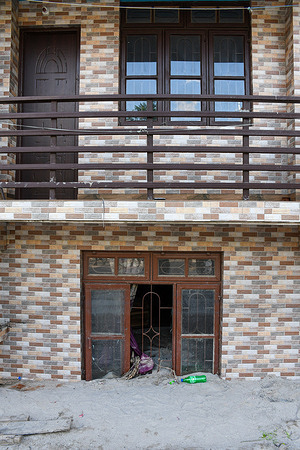 General view of the ground floor of a building is buried in debris caused by flash floods after a lake burst. After a glacial lake in northeast India burst through a dam shortly after midnight, washing away homes and bridges and forcing thousands to flee, rescue workers continued to dig through muddy debris.