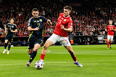 John McGinn #7 of Scotland and Joakim Mæhle #5 of Denmark seen in action during the FIFA World Cup 2026 qualifier match between Denmark and Scotland at Parken Stadium. Final score: Denmark 0 :0 Scotland.