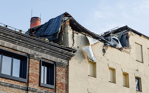 The damaged roof of the Roshen confectionery factory in Kyiv's Holosiivskyi district is seen following a massive combined attack involving kamikaze drones. A large hole in the upper structure is seen where a drone strike tore through the building. Over Saturday night, January 24, Ukraine came under another massive combined attack as the enemy launched over a hundred kamikaze drones and missiles from strategic aircraft. 
The Roshen confectionery factory was hit. A drone strike damaged the building's top floor, tearing a hole in the roof, shattering windows with the blast wave, and damaging the signature signage on the facade. Both production facilities and office spaces sustained damage. Tragically, a 48-year-old woman was killed in the attack, and two others were injured.
The Kyiv confectionery factory is one of the city’s oldest enterprises, founded in 1874. Today, Roshen is ranked among the top 30 largest confectionery producers globally and remains a market leader in Eastern Europe.