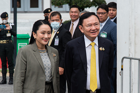 Thaksin Shinawatra, a former Thailand's PM, seen with his daughter Paetongtarn Shinawatra at the Thailand's Supreme Court in Bangkok before a verdict in his case. The Thailand's Supreme Court has ordered Thaksin Shinawatra ,a former Thailand's PM, serve 1 year in prison after a verdict in his case of prolonged hospital stay to avoid a prison sentence in 2023.