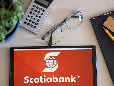 In this photo illustration, ScotiaBank logo seen displayed on a tablet.
