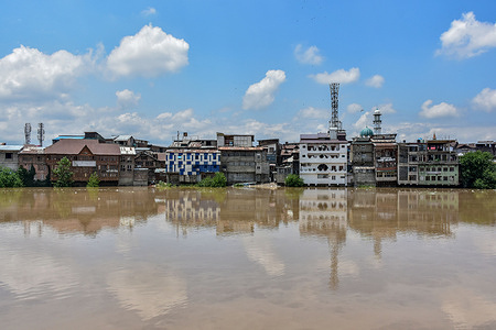 A view of river Jehlum flowing over the flood-alert mark following incessant rains in Srinagar. The Jhelum was flowing over flood-alert mark in south Kashmir and Srinagar amid cloudy weather and the possibility of more rains over the next 24 hours.