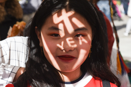 A woman poses for a picture during the celebration of the Chinese Lunar New Year in Barcelona. The Chinese Lunar New Year, the Year of the Pig, begins on February 5 2019 and ends on January 24 2019.