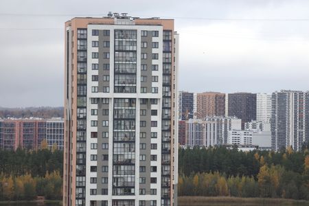 View of an apartment building in the Primorsky District of St. Petersburg during autumn.