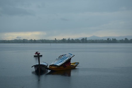 View of dal lake during rain in Srinagar summer capital of Indian Kashmir. Rains To lash the Kashmir valley on Wednesday meanwhile some upper mountain areas received fresh snowfall brings down the temperature across the valley and expected to be lashed over one more day forcasted by MeT department.