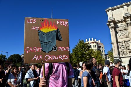 A protester holds a placard expressing his opinion during the demonstration. Thousands of high school students marched through the streets of Marseille to protest against budget cuts affecting high schools and the entire national education system.