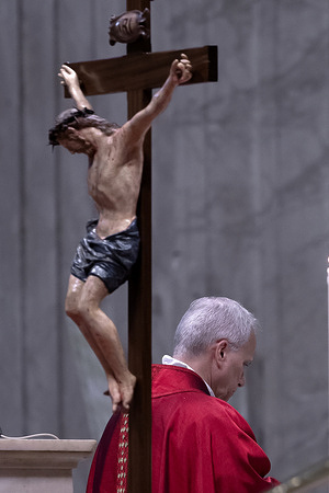 Pope Leo XIV seen celebrating the Passion of the Lord on Good Friday in St. Peter's Basilica .