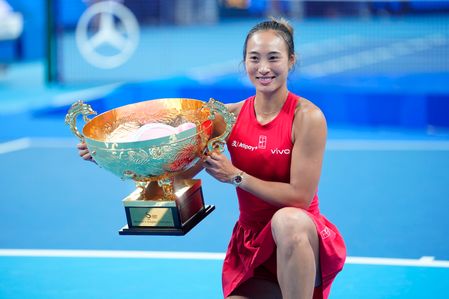 Qinwen Zheng of China celebrates with her trophy after winning the final match against Mirra Andreeva of Russia (not in view) during the Tennis China Open at National Tennis Center