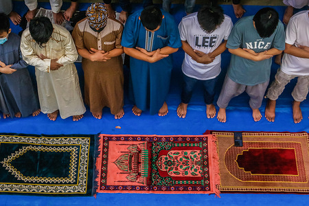Muslims recite a morning prayer at an elementary school during the Feast of Sacrifice. Eid al-Adha, also known as the Feast of Sacrifice, is Islam's second and biggest worldwide celebration. It commemorates Prophet Ibrahim's obedience to Allah through his willingness to sacrifice his son Ismail.