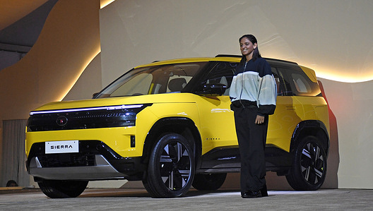 Harmanpreet Kaur (R), India women's cricket captain poses for a photo with Tata Sierra SUV car at its unveiling event in Mumbai. The SUV car was unveiled at an event before its launch on 25th November 2025.