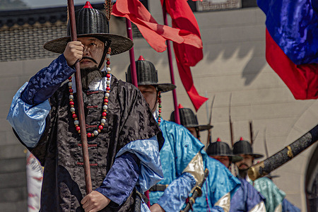 Royal guards perform 'The Changing Ceremony of the Royal Guard' at Gyeongbokgung Palace in Seoul, South Korea.
The ceremony reenacts Joseon-era royal security customs, as guards in traditional uniforms carry historical weapons, exchange symbolic keys, and march in precise formations at Gwanghwamun Gate, the main entrance to the palace.